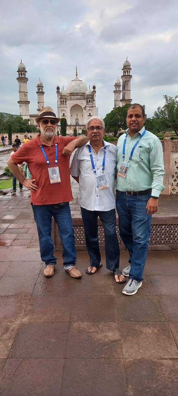 Three delegates posing in front of Bibi Ka Maqbara, Aurangabad