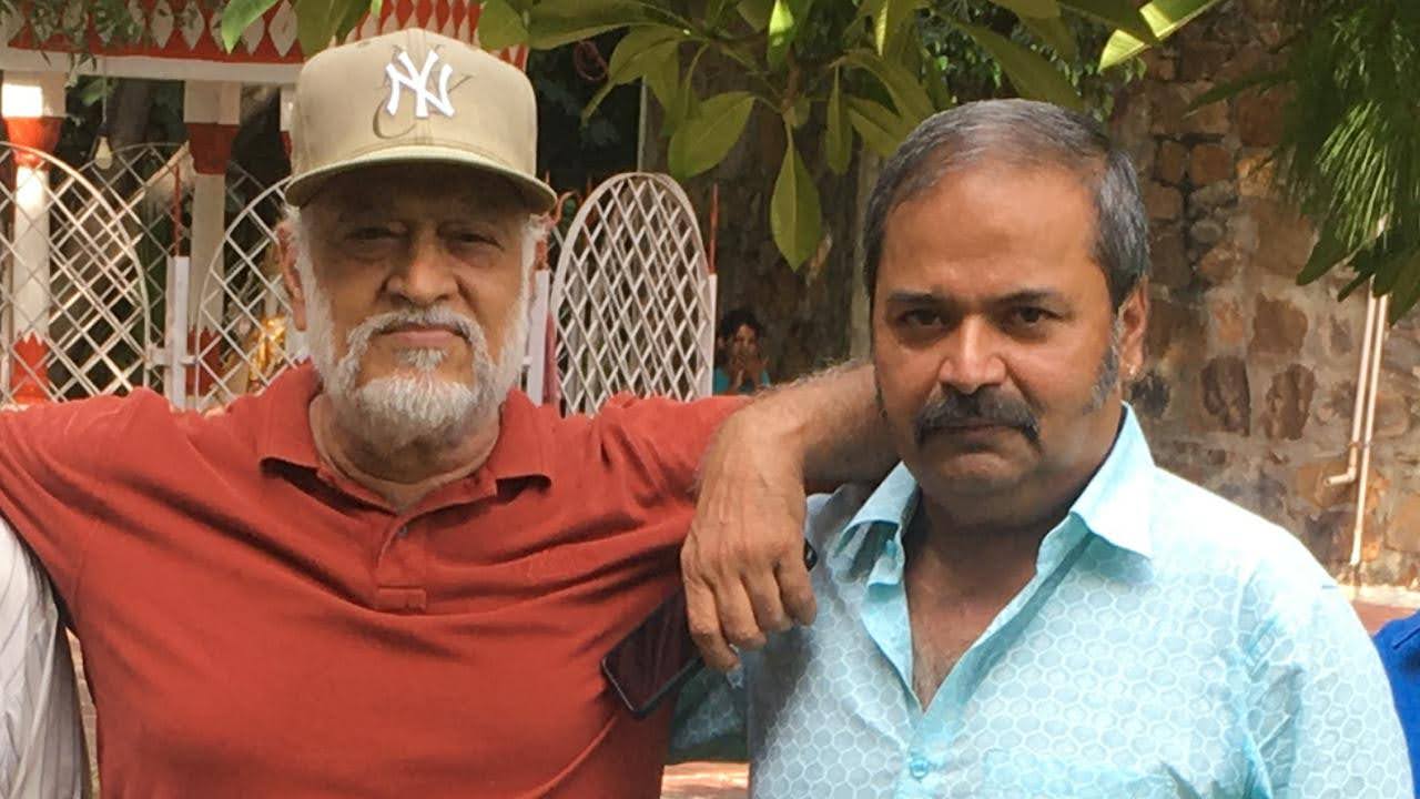 Close portrait of Vipin Bhardwaj with a colleague at a garden gathering