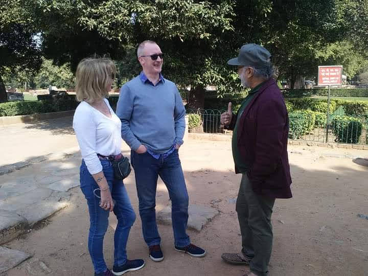 Vipin Bhardwaj speaking with international visitors at a heritage park