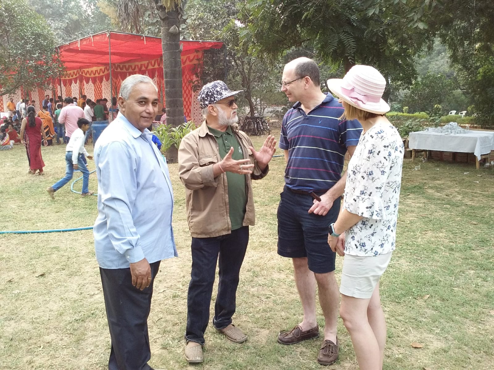 Vipin Bhardwaj in conversation with international guests at an outdoor event