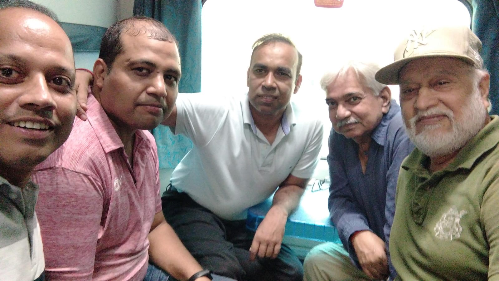 Vipin Bhardwaj with fellow travellers in a train compartment