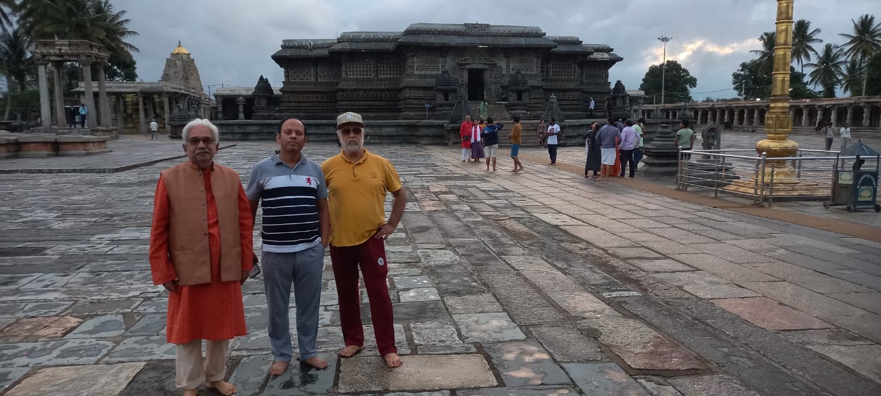 Vipin Bhardwaj with colleagues before the Chennakeshava Temple at dusk