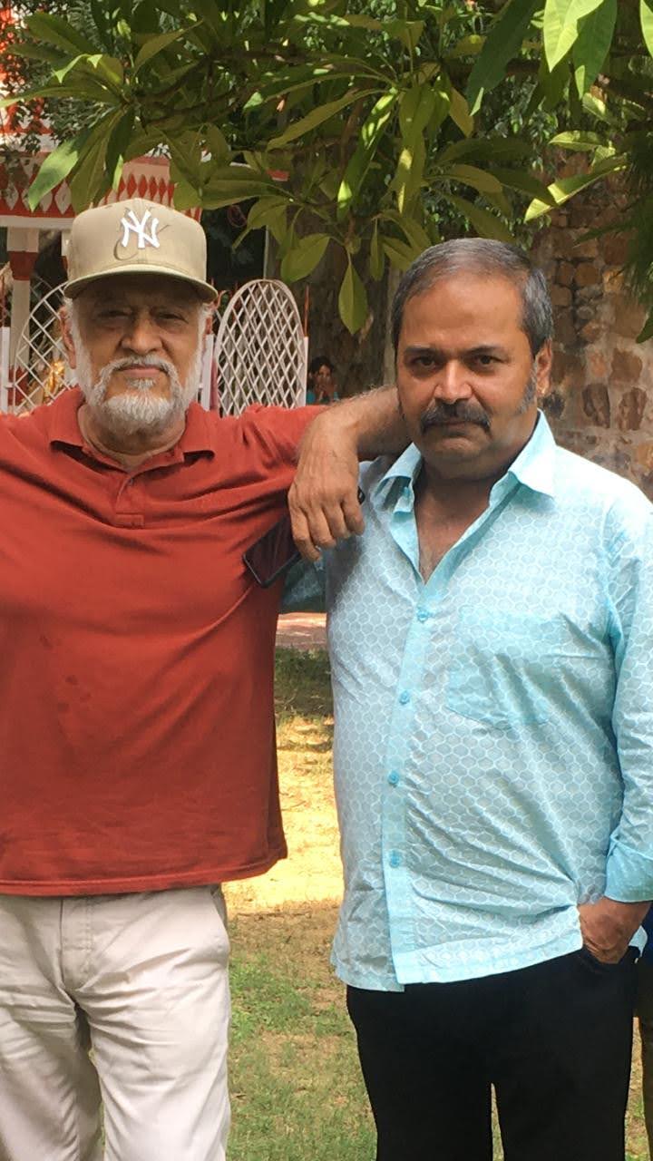 Vipin Bhardwaj standing with a colleague in a garden