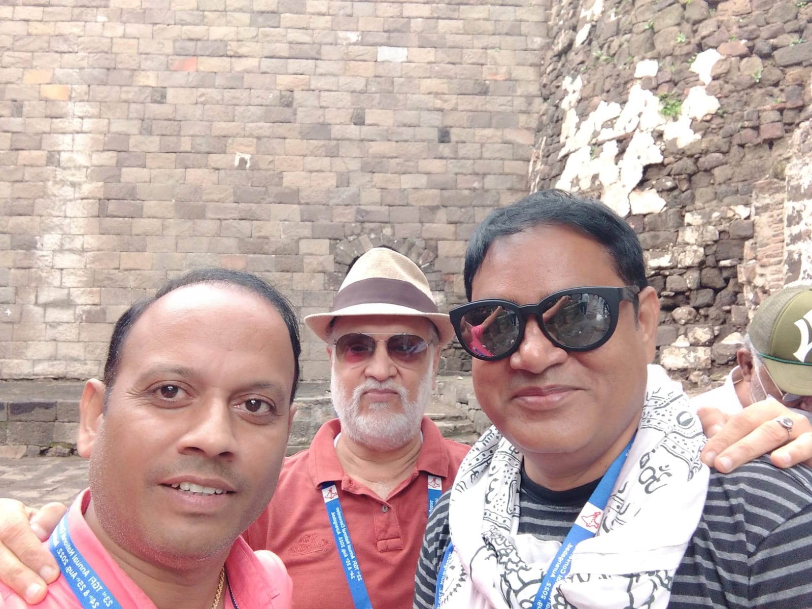 Selfie with fellow delegates beside a fort wall during a national convention